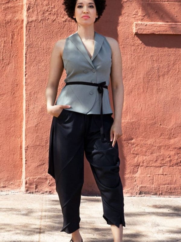 Singer Julia Bullock standing in front of a terracotta wall