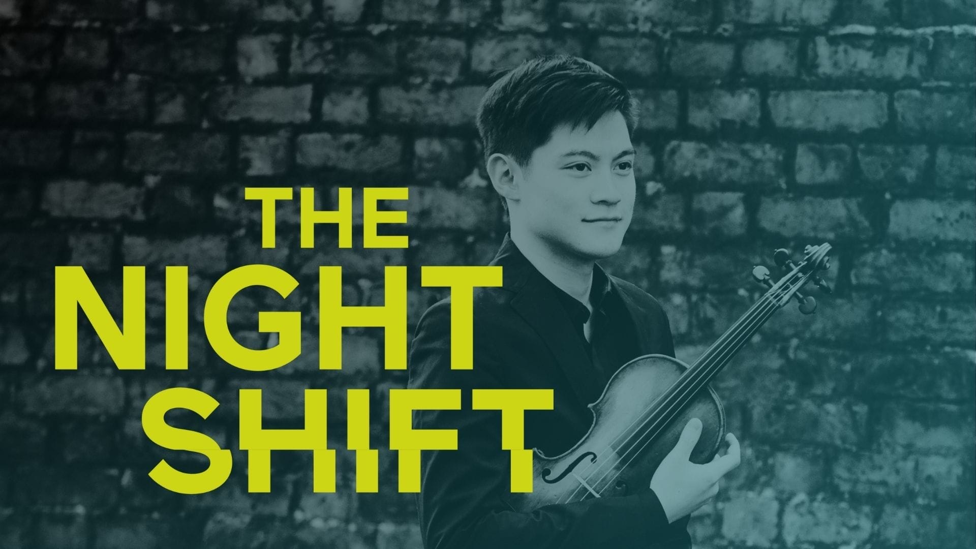 Violinist Henry Tong standing in front of a wall - the words THE NIGHT SHIFT are written on the photo
