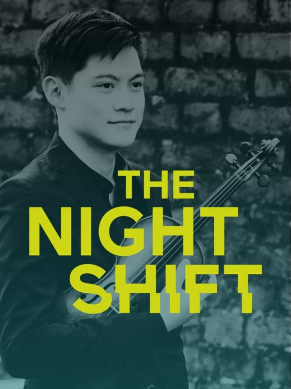 Violinist Henry Tong standing in front of a wall - the words THE NIGHT SHIFT are written on the photo