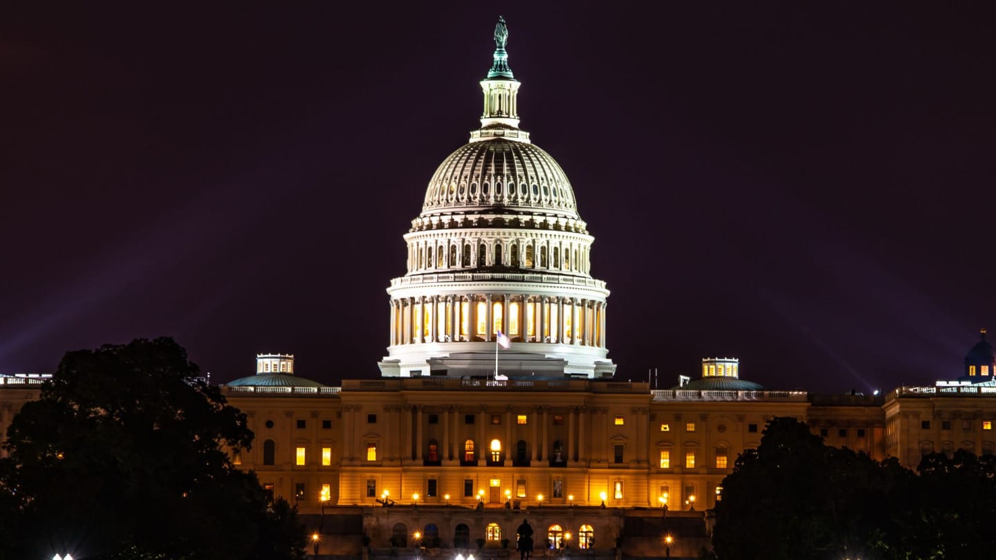 The US Capitol building illuminated at night