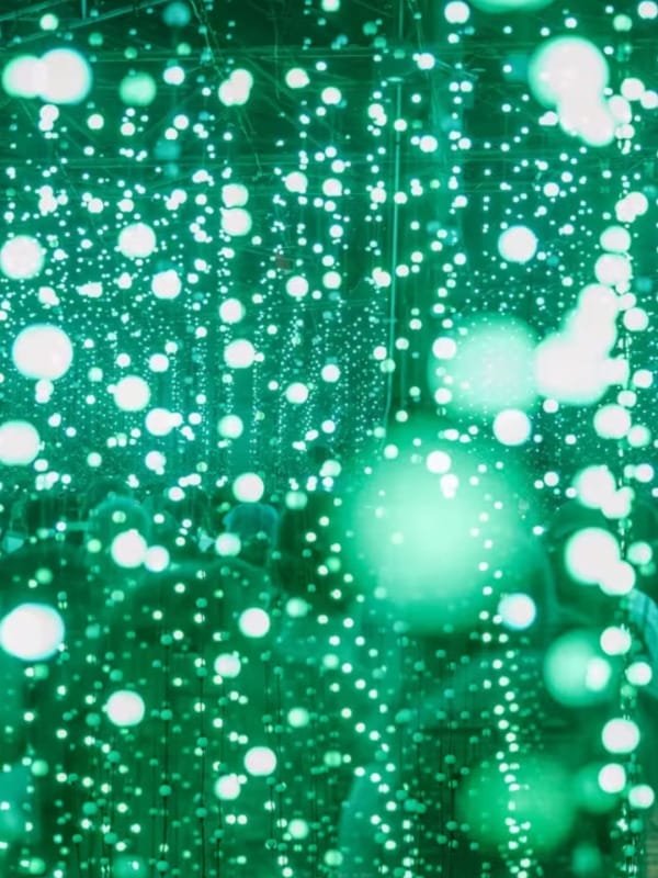 A photo of a green-coloured light installation by Squidsoup