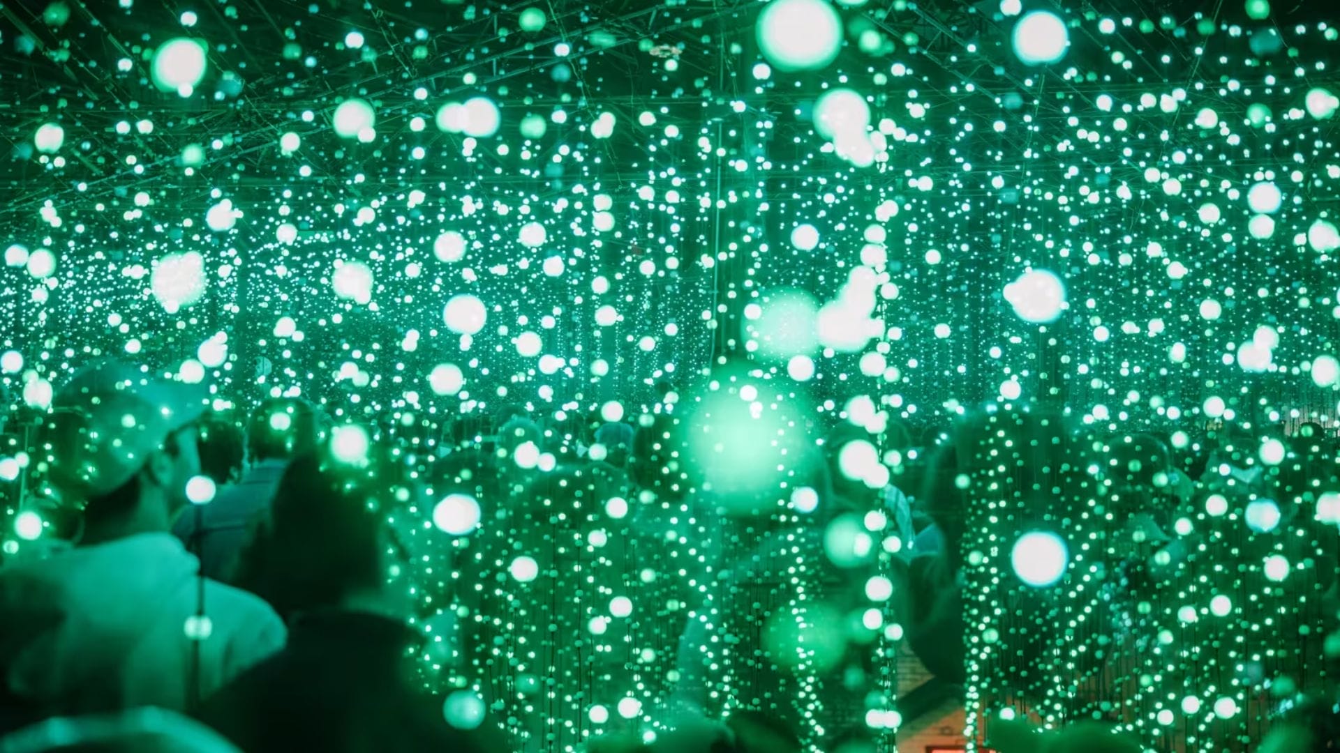 A photo of green coloured light installation by Squidsoup