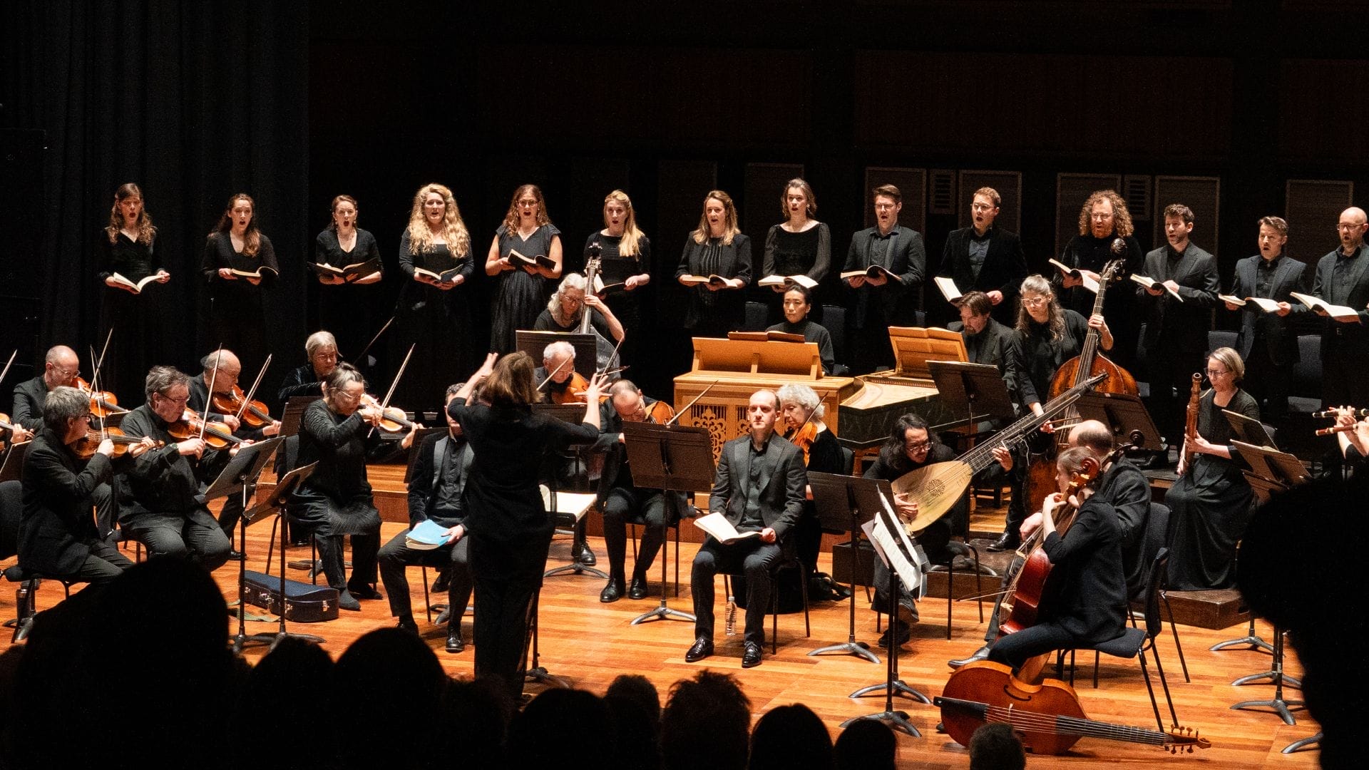 The Orchestra of the Age of Enlightenment on stage performing Bach's St John Passion with the Choir at the back.
